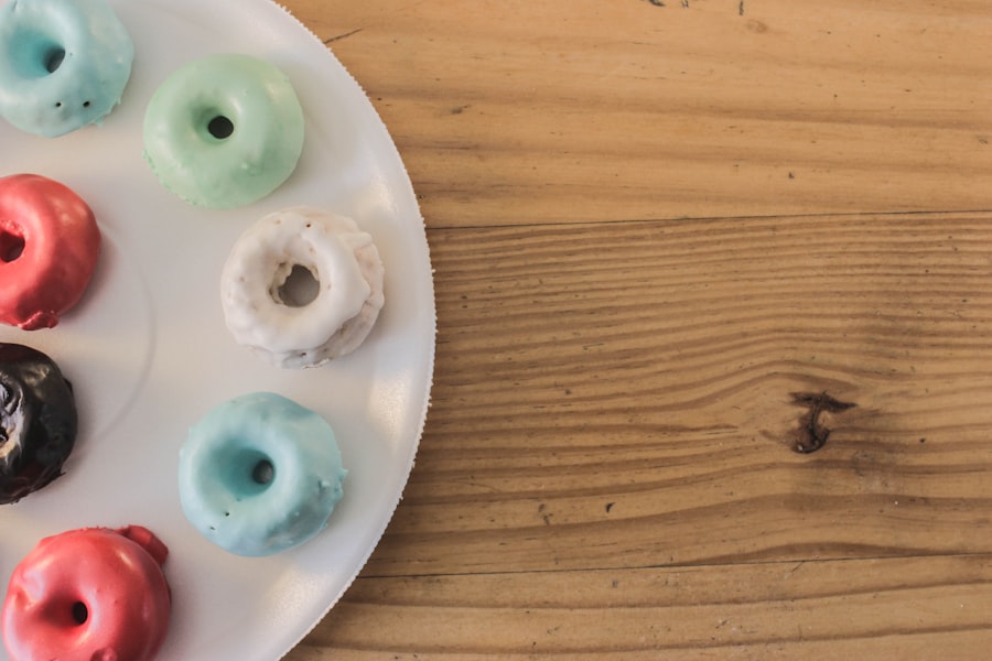 Assorted colorful donuts laid out on a plate for party planning