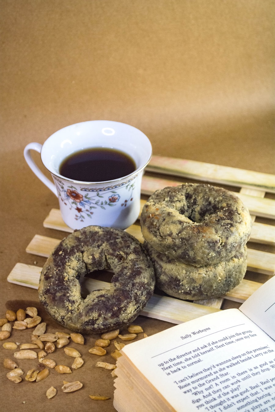 Doughnuts beside a cup of coffee for a birthday breakfast surprise