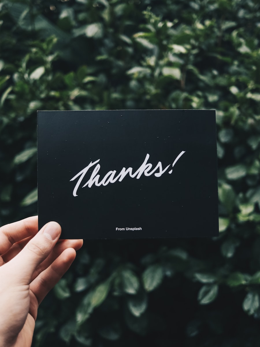 Hands holding a small thank-you card that sets up the donut countdown