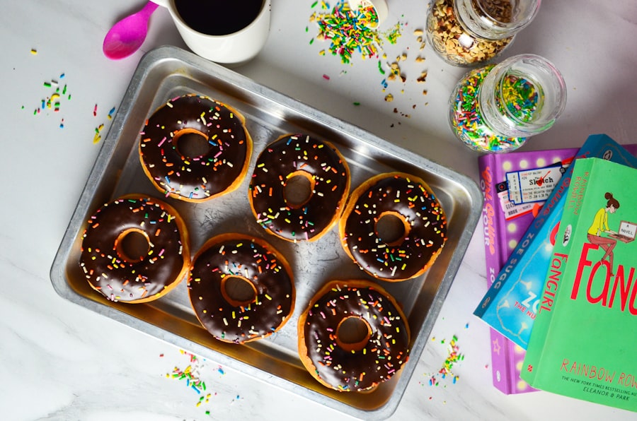 Tray of chocolate-frosted donuts staged before the workday starts
