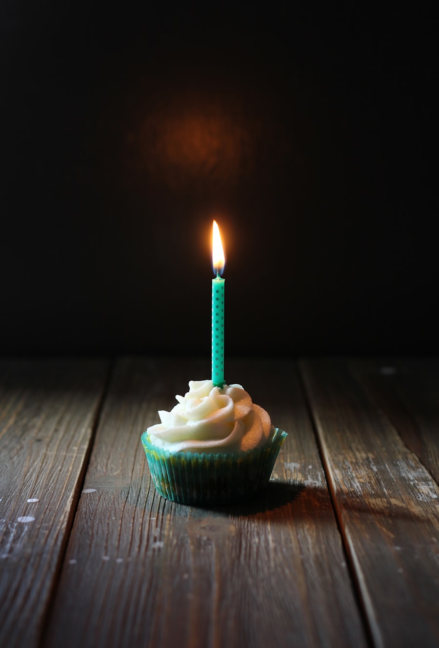 Single birthday candle on a frosted treat with the recipient’s name on everything