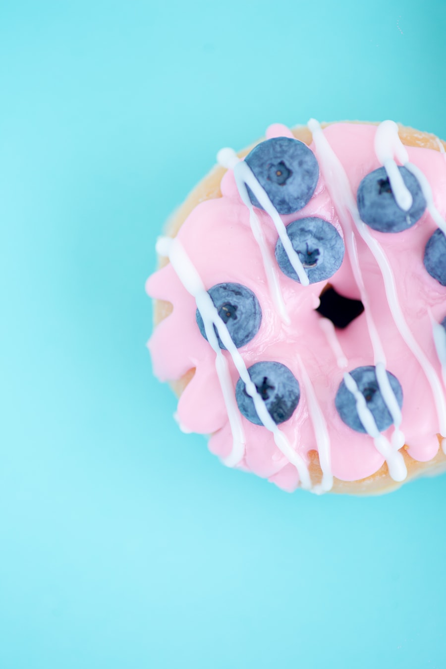 Frosted birthday donut close up, part of an annual tradition