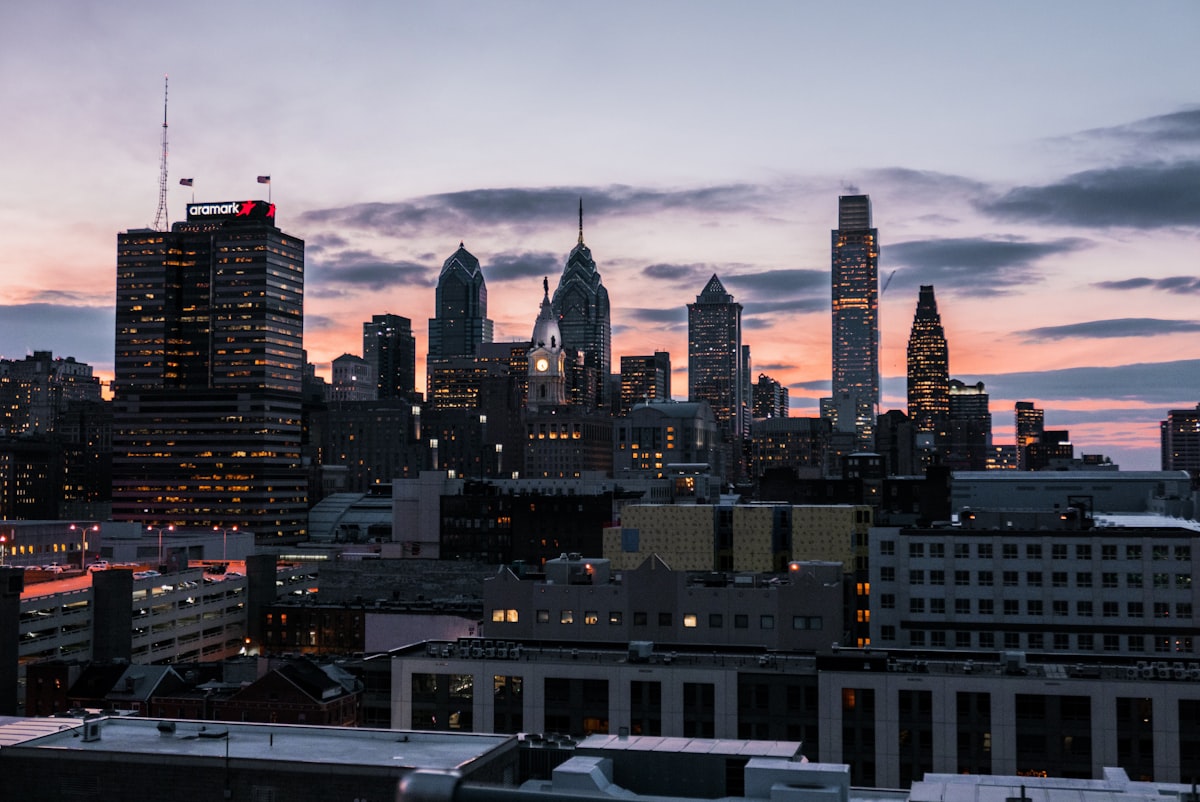 Philadelphia skyline lit up at golden hour
