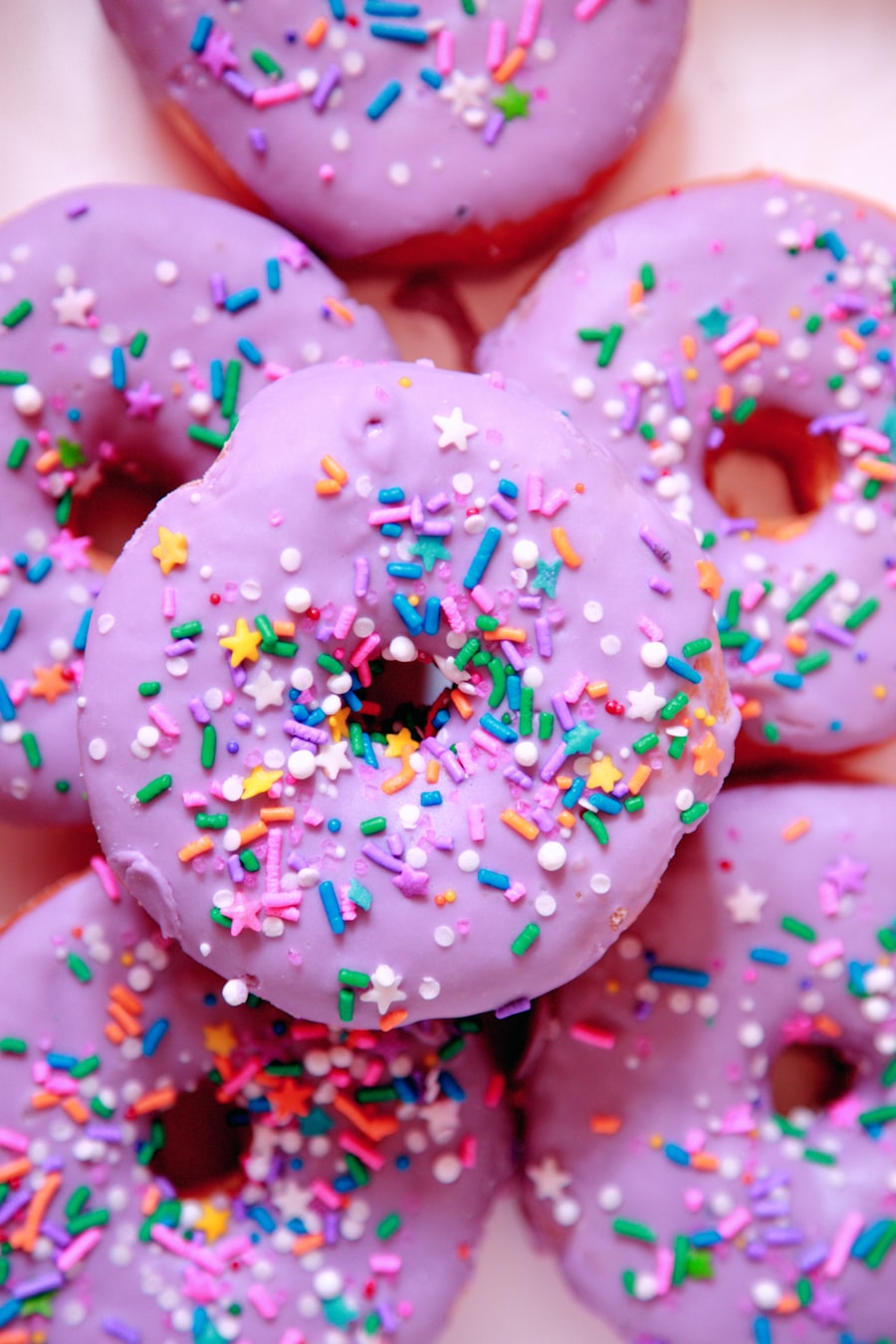 Celebration Box — pink sprinkle-frosted donuts stacked for a celebration